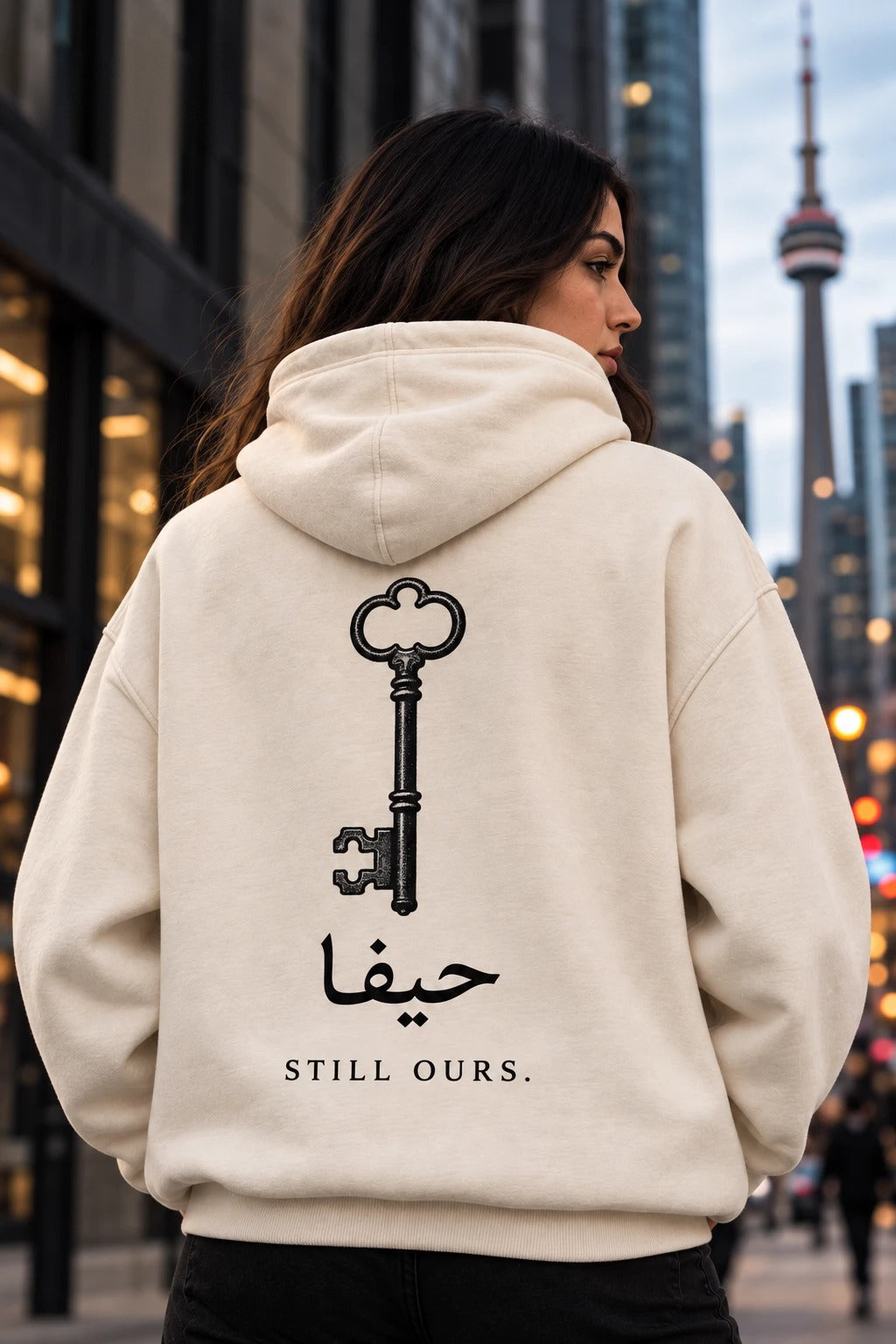 The Key — Al-Awda cream hoodie with antique key and Still Ours back print